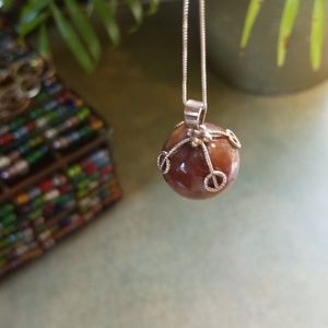 UNIQUE AGATE BALL W/BRAIDED DESIGN ON CHAIN